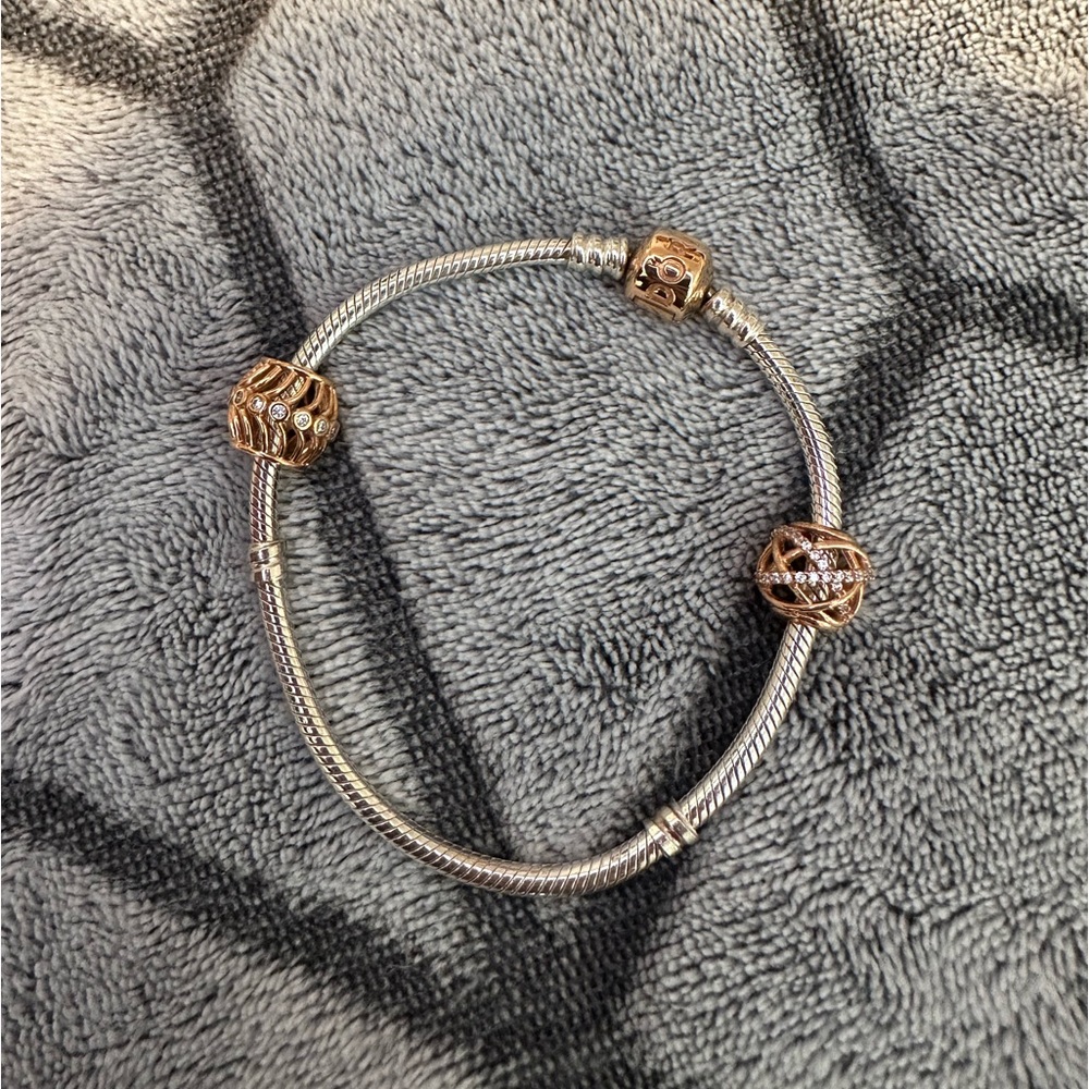 Silver Pandora bracelet with three rose gold charms